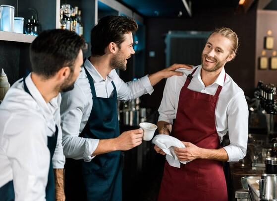 stock-photo-smiling-barman-drinking-coffee-talking